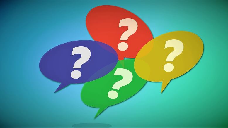 Four coloured circles with question marks in them